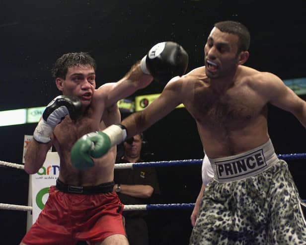 Manuel Calvo of Spain lands a left jab during the IBO Featherweight Championship of the World fight between Prince Naseem Hamed and Manuel Calvo of Spain at the London Arena on May 18, 2002. (Photo by John Gichigi/Getty Images)