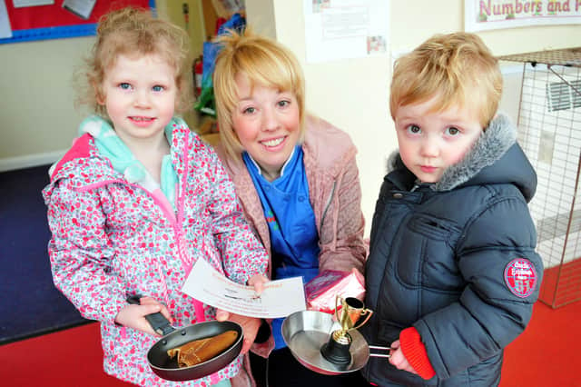 Nursery nurse Amanda Guttridge with the pancake race winners at Kiddikinns in 2014. Remember this?