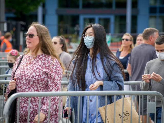 Customers being allowed into the main area of Gunwharf Quays as it reopened.