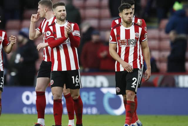 Oliver Norwood (L) of Sheffield United applauds the fans following a Premier League match at Bramall Lane, Sheffield: Simon Bellis/Sportimage