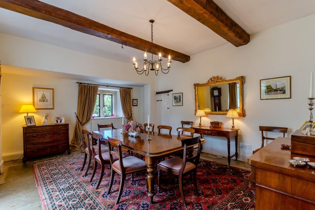 Wooden ceiling beams and flagstone floors give the formal dining room a sense of character, with the generous space providing plenty of space for entertaining.