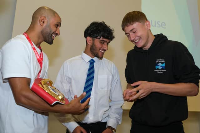 IBF World Featherweight Champion Kid Galahad returns to Hinde House School to show off his belt