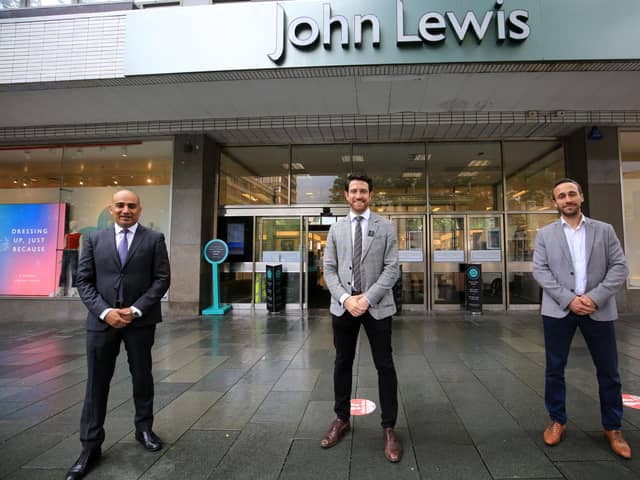 John Lewis has agreed a new 20-year lease to keep its department store in Sheffield city centre, and the deal includes plans for a refurbishment of the shop. Pictured are Councillor Mazher Iqbal, store manager Patrick Duffy, and Mike Norris from Queensberry. Picture: Chris Etchells.