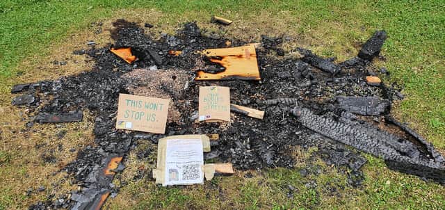 Messages left on the ashes of the installation after the arson attack