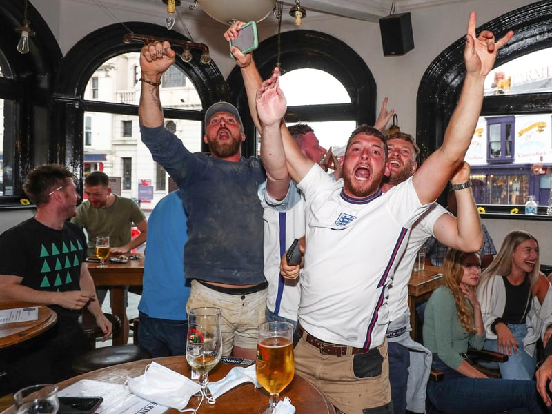 Fans pictured in The Kings pub celebrating as England score their first goal. Picture: Stuart Martin (220421-7042)