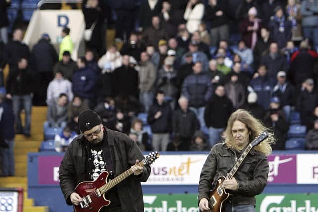 Doug Scarratt (R) and Paul Quinn of rock band Saxon at Hillsborough. (Photo by Christopher Furlong/Getty Images)