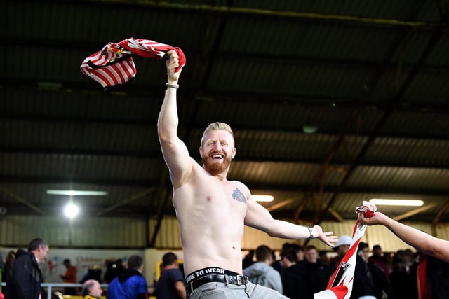 A Sunderland supporter celebrates a victory earlier in the season.