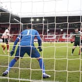 David McGoldrick scores Sheffield United's goal during the 3-1 defeat by Tottenham Hotspur at Bramall Lane: Andrew Yates/Sportimage
