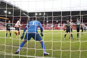 David McGoldrick scores Sheffield United's goal during the 3-1 defeat by Tottenham Hotspur at Bramall Lane: Andrew Yates/Sportimage