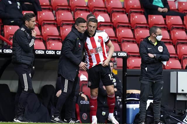 Sheffield, England, 23rd May 2021. Phil Jagielka of Sheffield Utd (R) talks to manager Paul Heckingbottom during the Premier League match at Bramall Lane, Sheffield. Picture credit should read: Andrew Yates / Sportimage