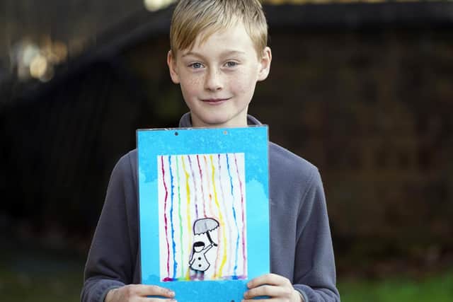 Jasper Mumby with his colourful artwork