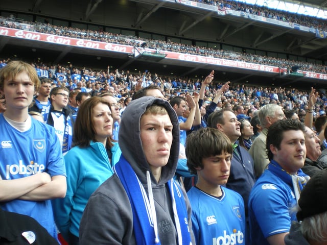 Pompey fans watch on from the stands.