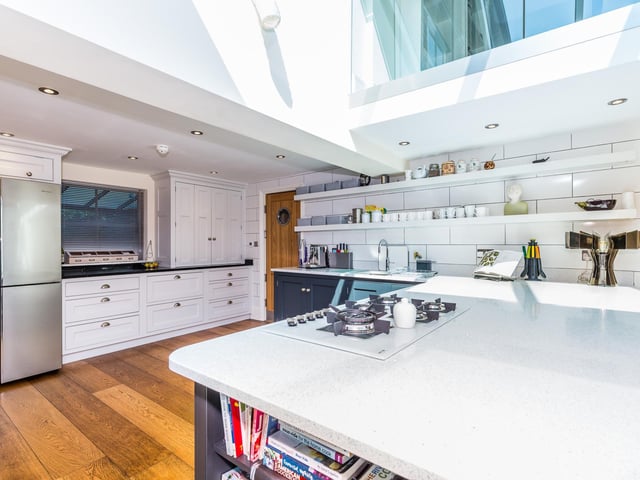 If this kitchen isn't big enough for you there is also a second one through the wood door.