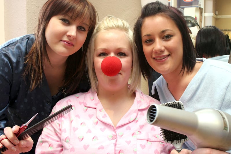 Martina Stapleton, Kayleigh Oxspring,  and Hollie Lowe wear pyjamas to work at Passion Hairdressers in Dronfield. Do you remember what year it was?