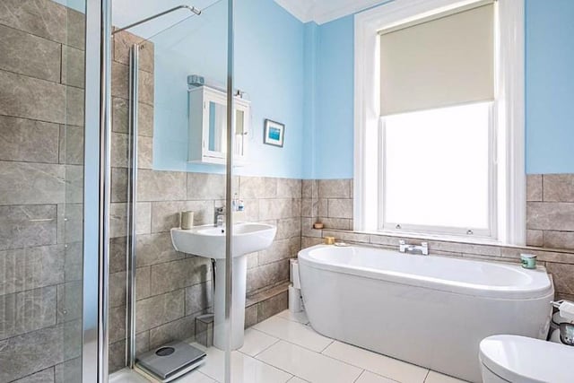 On the first floor there are two further double bedrooms and a family bathroom that again has a white suite with a separate shower enclosure.