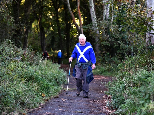 A walker on one of the many paths at Culzean.