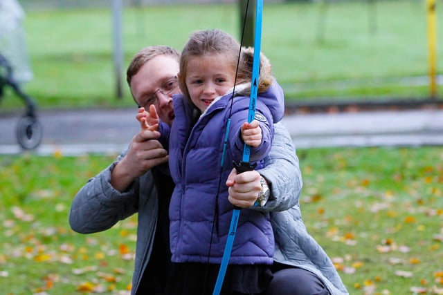 Phillip West and daughter Emilie (5) from Falkirk try their hand at archery