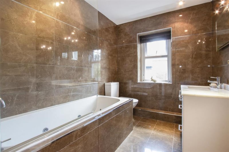 Unwind in this luxurious bathroom and let the stresses of the day melt away.