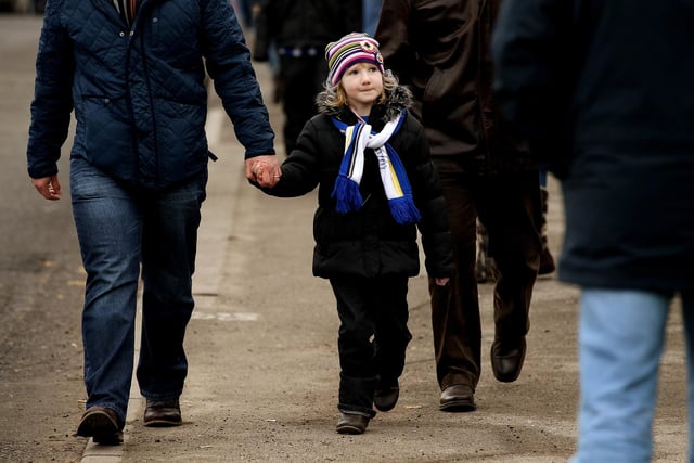 A young Wednesday fan makes her way to Hillsborough for the third round tie against West Ham United in January 2012.