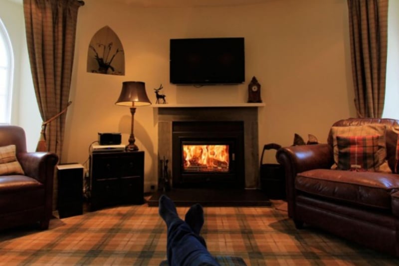 A wood burner provides welcome warmth in the living area.
