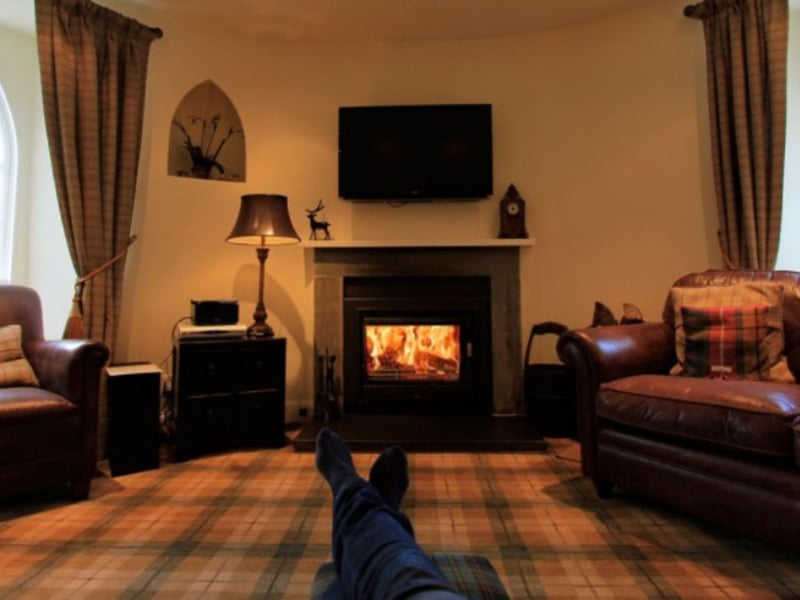 A wood burner provides welcome warmth in the living area.