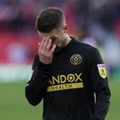 Sheffield United midfielder Oliver Norwood looks dejected after the final whistle at Stoke City: Andrew Yates / Sportimage