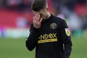 Sheffield United midfielder Oliver Norwood looks dejected after the final whistle at Stoke City: Andrew Yates / Sportimage