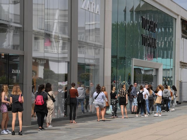 Lengthy queues formed outside Topshop in Brighton as it reopened to customers.