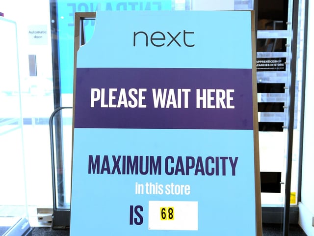 The store is operating a maximum capacity of shoppers.