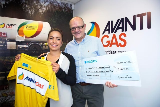 AvantiGas cheque presentation to Marie Curie Cancer Care in 2014 Neill Cordon (HR Manager AvantiGas) presents a cheque for £1605.24 to Gemma Chance from Marie Curie Cancer Care, the money was raised through selling Avanti branded Tour de France style yellow jerseys.