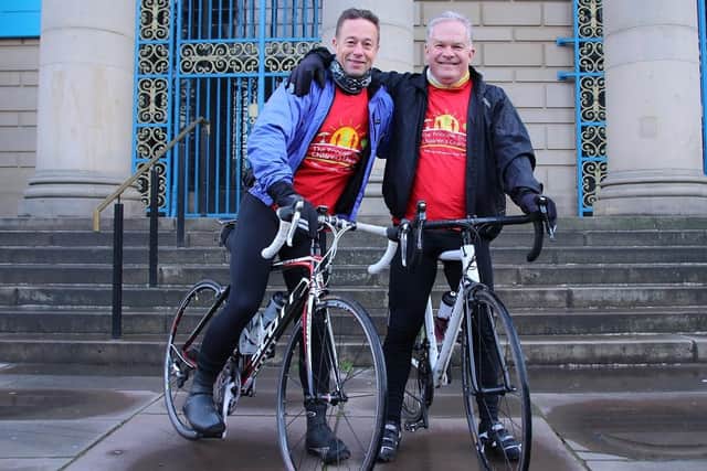 Darren Hirst , left,and Simon Thomas depart from Sheffield City Hall on their 130-mile ride to Lake Windermere in aid of The Principle Trust, who provide holidays for children from disadvantaged or difficult backgrounds