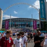 LONDON, ENGLAND - JUNE 13: Football fans leave Wembley stadium after of England's first fixture of the Euro 2020 competition with Croatia on June 13, 2021 in London, United Kingdom. Fanzones and pubs are hosting England fans around the country as England take on Croatia at Wembley in the first game of Euro 2020. (Photo by Chris J Ratcliffe/Getty Images)