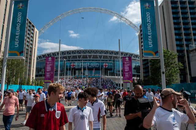 LONDON, ENGLAND - JUNE 13: Football fans leave Wembley stadium after of England's first fixture of the Euro 2020 competition with Croatia on June 13, 2021 in London, United Kingdom. Fanzones and pubs are hosting England fans around the country as England take on Croatia at Wembley in the first game of Euro 2020. (Photo by Chris J Ratcliffe/Getty Images)