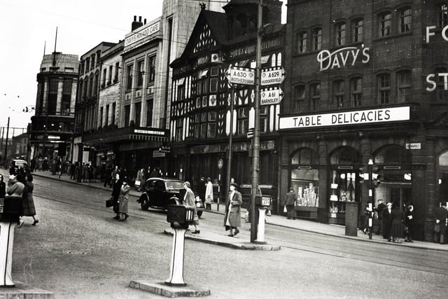 Haymarket - where hay was once bought and sold - is one of Sheffield's oldest thoroughfares.  In the Fifties, when this picture was taken, it was dominated by Davy's food store, with "The Old No 12" restaurant next door, and beyond it, Davy's Mikado Cafe.  Before the war, the Mikado offered an old-style Yorkshire tea, complete with ham or bacon and egg, for 1s 6d.  Further along Haymarket can be seen the old Brunswick pub.