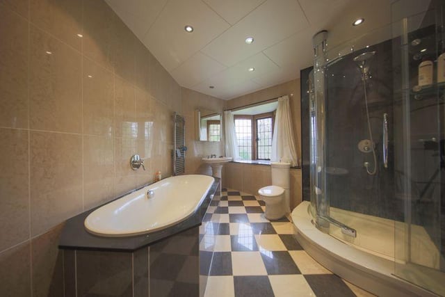 The main bathrooms is large and has a separate shower and bath.