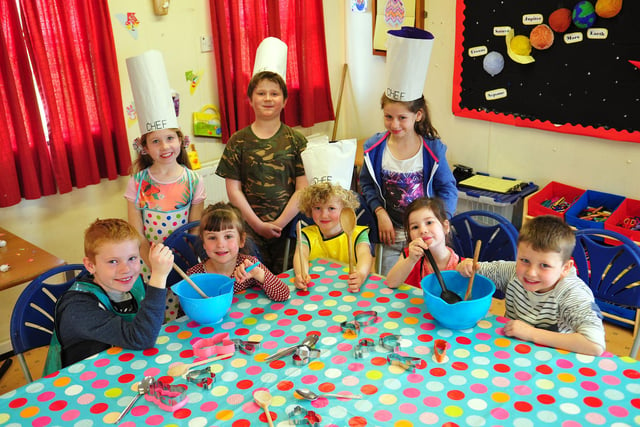 Children from Oscars Playscheme were ready to bake their Easter hot cross buns in this 2014 scene.