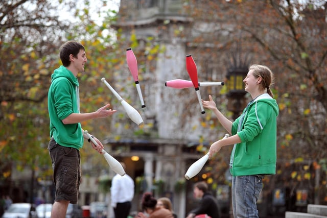 2011. Harry Cooper (22) and Siobhan Dolan (19) from the University of Portsmouth Society of Circus Skills entertain passers by in the Guildhall Square to raise money for Children in Need.
Picture: Steve Reid 114113-109
