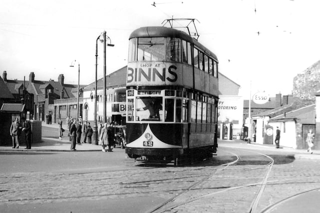 Trams and buses at the Wheatsheaf Junction in June 1952.