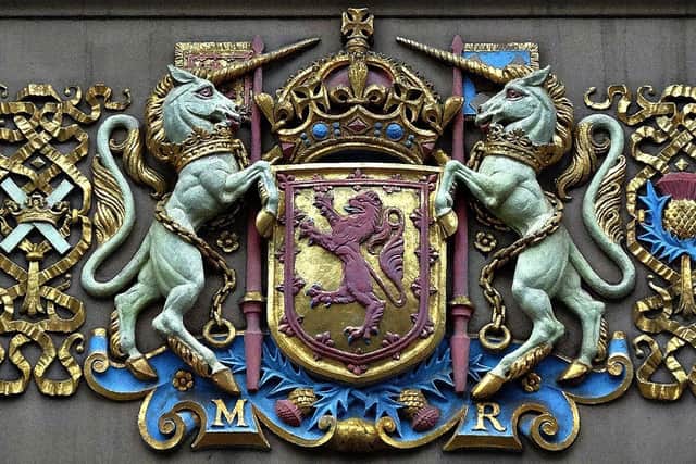 The coat of arms for Mary, Queen of Scots over the door at the City Hall