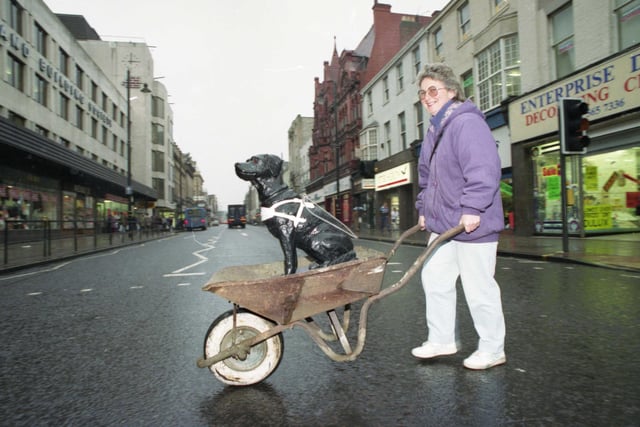 Hobo the black labrador charity dog that stood inside Binns store for 15 years collecting hundreds of pounds for Sunderland and South Shields Guide Dogs Association finds himself outside the store and homeless. He is pictured with owner Jennifer Emerson but in which year?
