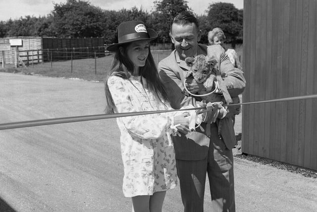 The Hon. Isobella Lambton cuts a tape to mark the official opening of Lambton Lion Park in July 1972.