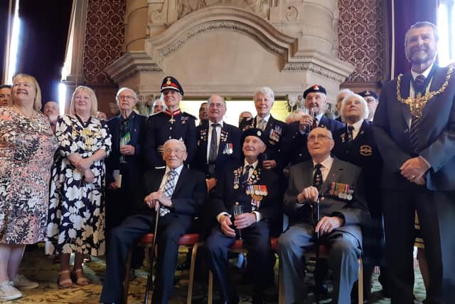 One of Sheffield's last remaining Normandy Veterans from World War Two, Cyril Elliott, front row, seated middle,, with dignitaries at his 103rd birthday reception at Sheffield Town Hall