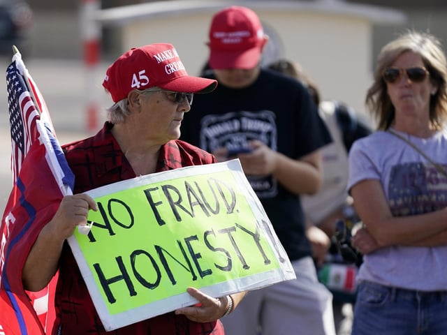 Supporters of President Donald Trump rally outside the Maricopa County Recorder's Office (AP Photo/Ross D. Franklin)