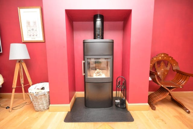 Focal point of the sitting room is a wood burning stove.