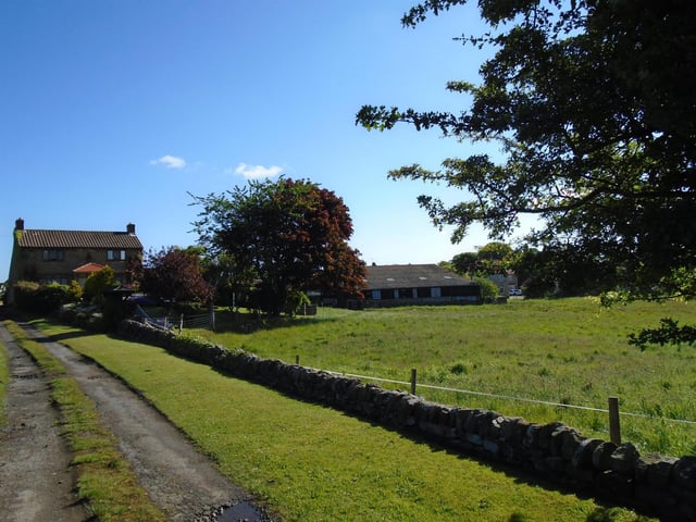 The farmhouse is surrounded by more than two acres of south-facing land.