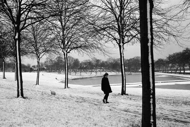 A girl walking beside a frozen Inverleith Pond in December 1962.