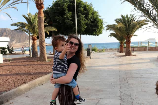 Gran Canaria.  A Sheffield doctor quit work to travel for a living and now earns £6k a month - by helping others to find budget deals. Jenna Carr and Joao Paias, are pictured with their son