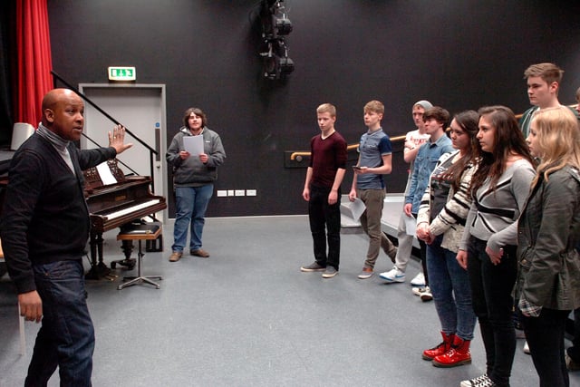 Vocal coach David Laudat works with music students at Hartlepool Sixth Form College in this scene from 2013.
