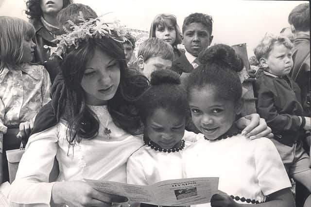 Sue Tomlinson (now Pearson), the Ebenezer Wesleyan Reform Church,Bramall Lane Sunday School May Queen with Evelyn and Sharron Thomas, her train-bearers, singing hymns at Meersbrook Park on May 25, 1970