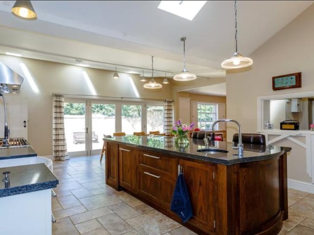 The open plan kitchen was refitted in 2010 and offers bi-fold doors opening onto a beautiful walled courtyard. The room features vaulted ceilings with glazed skylights, underfloor heating, an original servants hatch and a walk-in pantry.